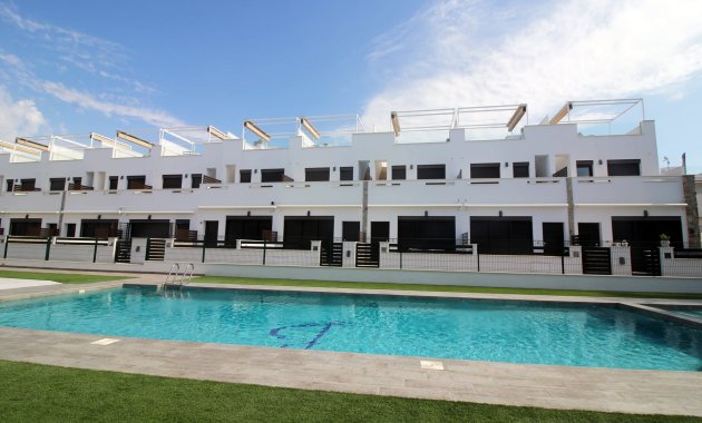 Obra nueva - Casa adosada -
Pilar de la Horadada